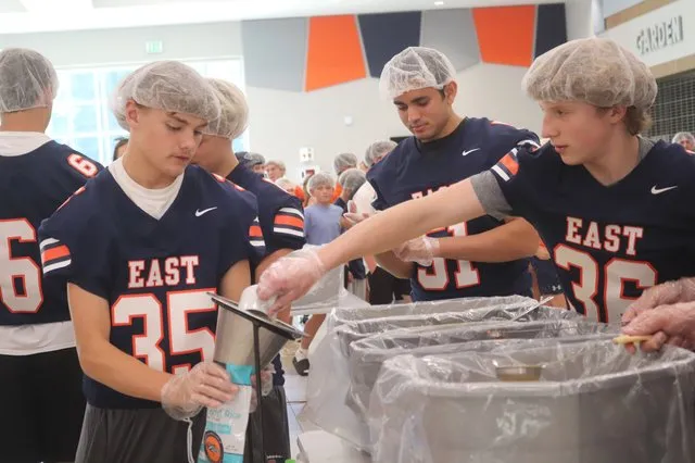 Football: East Forsyth program members help pack more than 10,000 meals