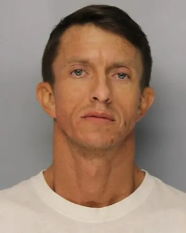 Clermont man charged with assaulting woman, pointing shotgun at her