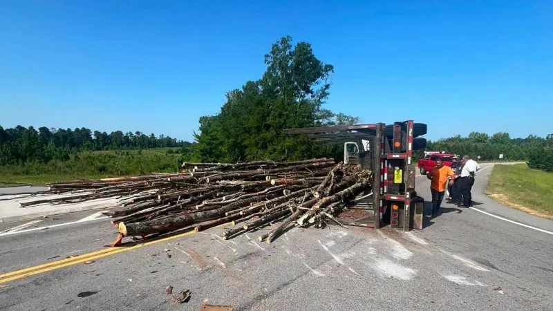 Log truck overturns in Washington County, drivers asked to use caution