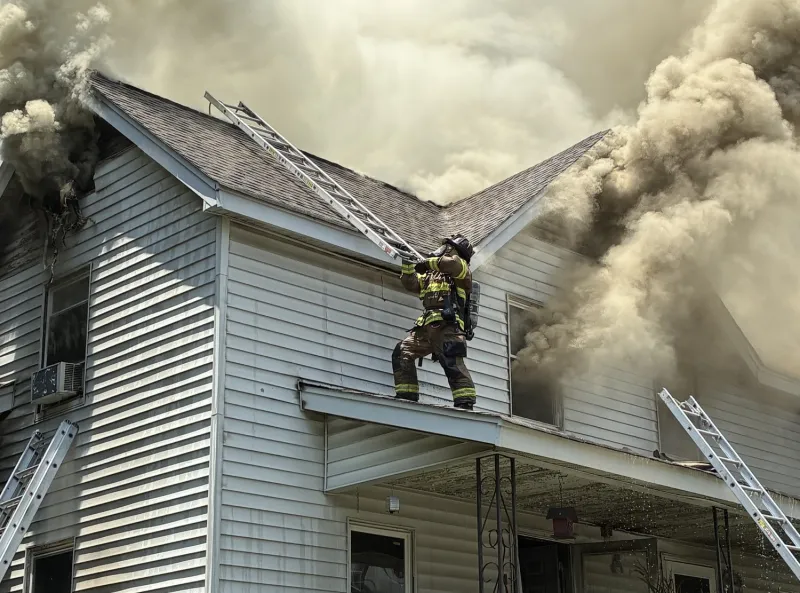 Firefighters rescue person trapped inside burning home in Hall County