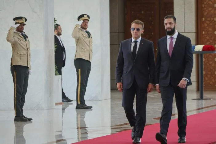 Explosions rock Damascus, wounding 4, as French President Macron visits Syria