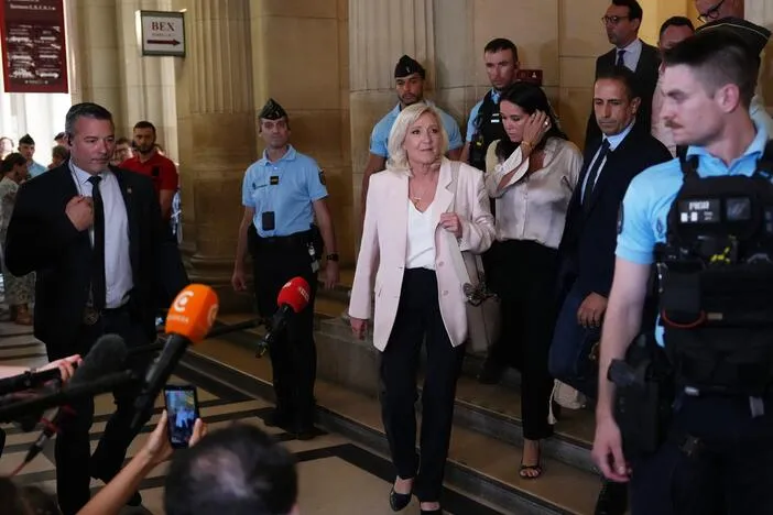 Le Pen says she'll run for French presidency next year despite court-ordered monitor