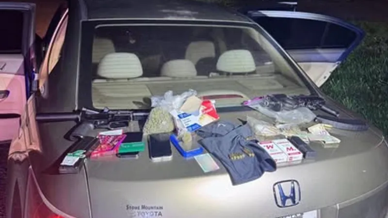 Two arrested after Bibb County traffic stop nets marijuana, rifles and ammunition