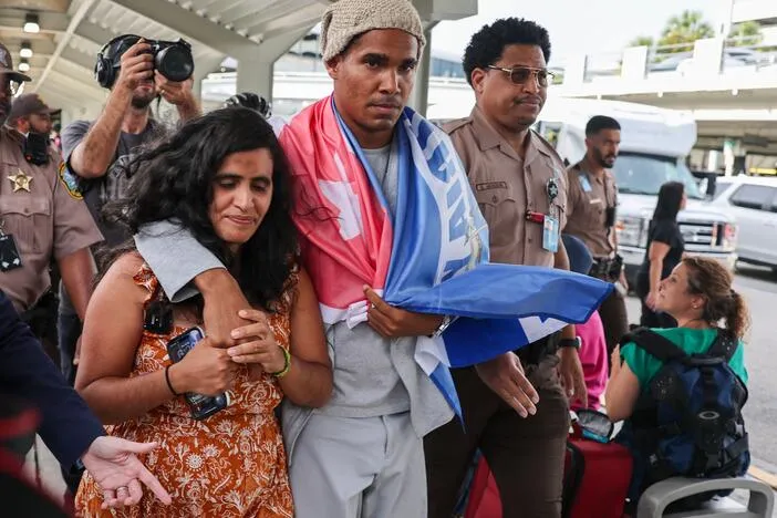 Cuban artist and dissident exiled from country after 5 years in prison arrives in US