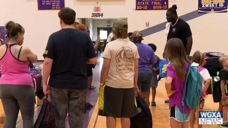 Bleckley County native and Bengals lineman Amarius Mims hosts back-to-school giveaway