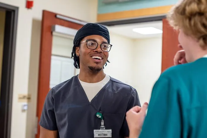 These men went to college in search of stable careers. They found it in nursing