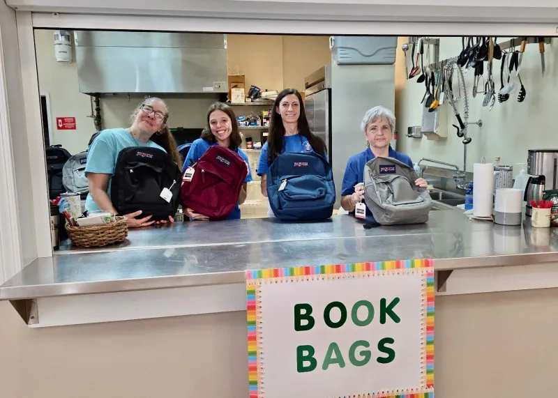 Church festival distributes 100 backpacks in under an hour