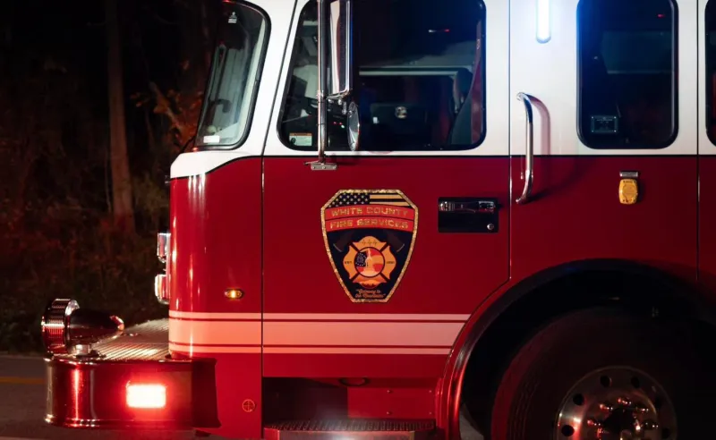 Residents escape burning home after RV fire spreads