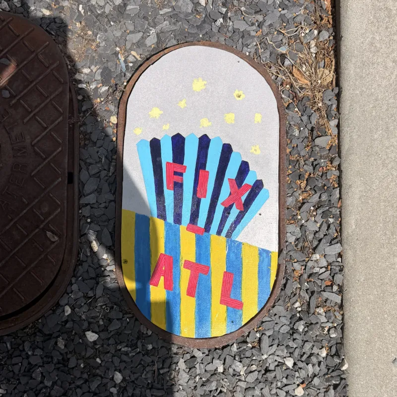 Anonymous account uses art to fill holes and create a rallying cry: 'Fix ATL'