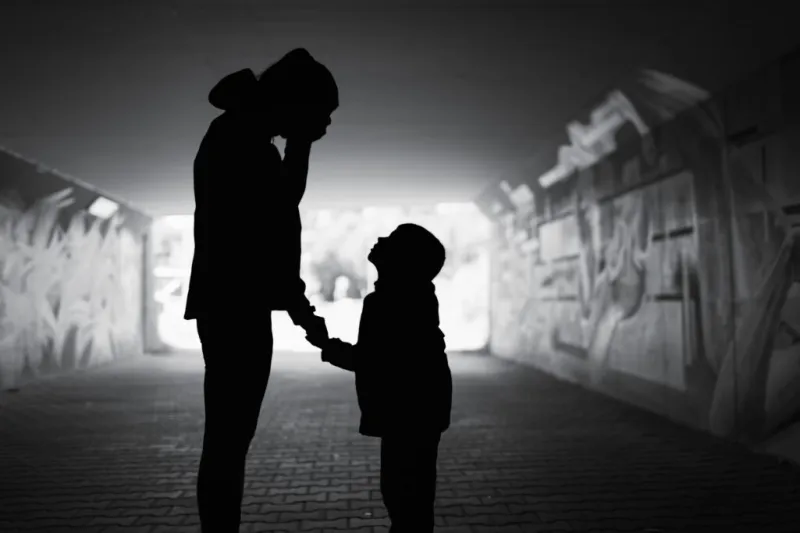 People in the shadows