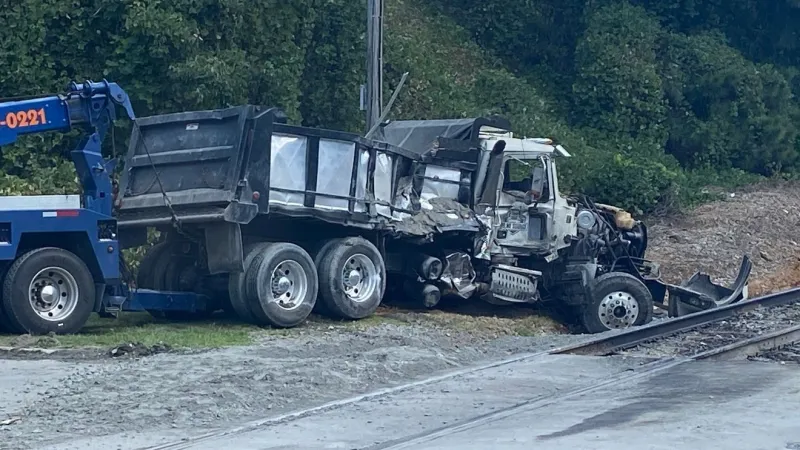 Dump truck driver hospitalized after crash with train along Highway 41 in Monroe County