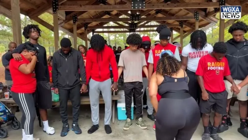 Red, black and gold fill Amerson Park as families walk and pray for healing