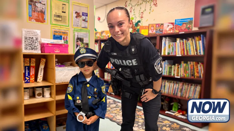 Morning fist bumps help Baldwin officer connect with Head Start students