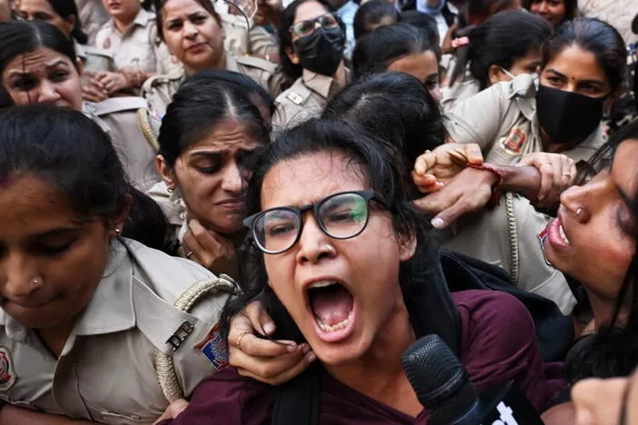 Crowds throng New Delhi and wave Indian flags amid escalating protests