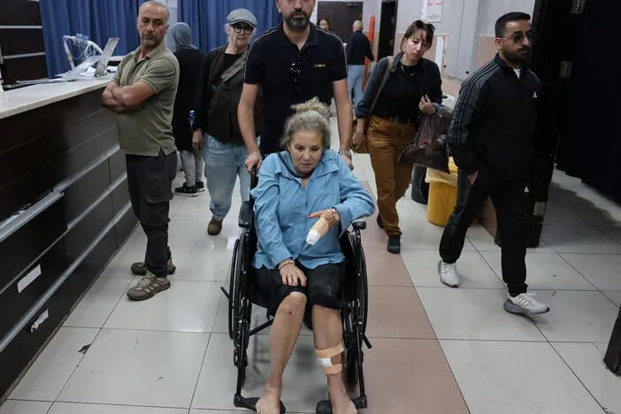 Israeli settlers beat Palestinians and a U.S. photojournalist in West Bank attacks