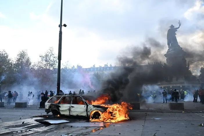 French police arrest 1,800 after violent clashes and looting mar protests