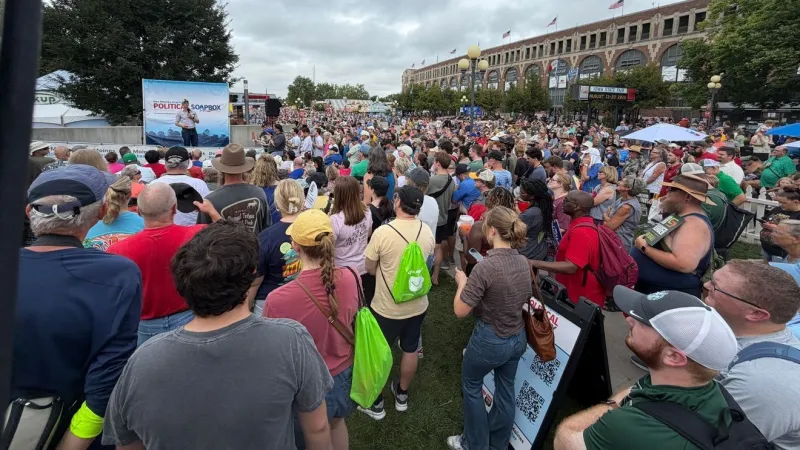 Sand draws large fair crowd, emphasizes working across party lines