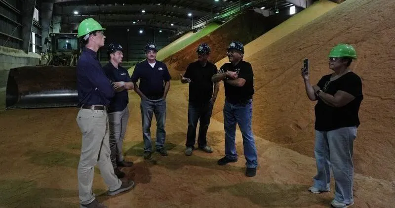 Rob Sand talks to Iowa farmers during Story County campaign stop