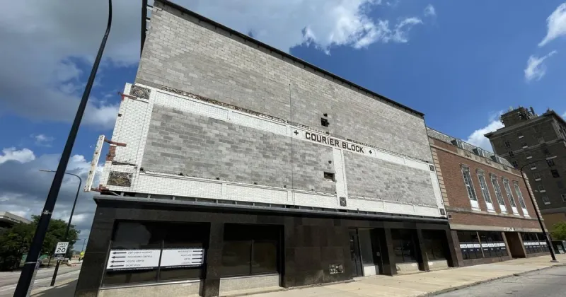 Owner for former Courier building cited for loose, falling bricks