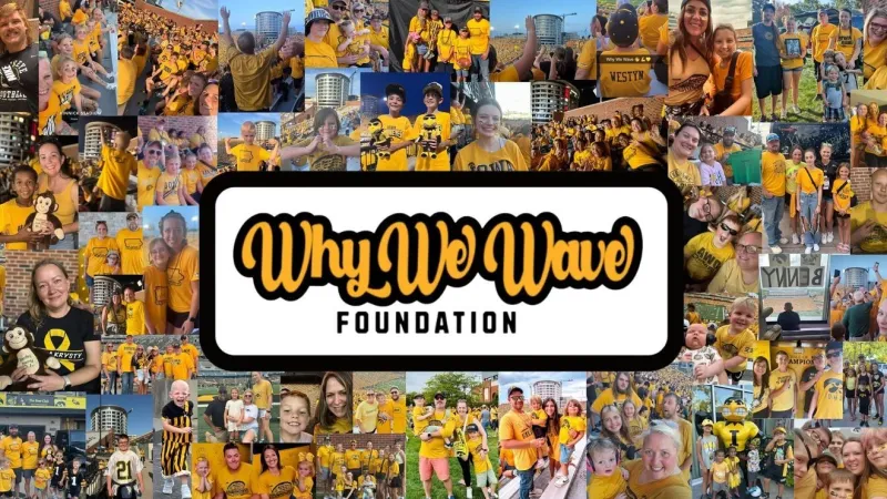 500 pediatric cancer family and friends wave together on the other side of the glass