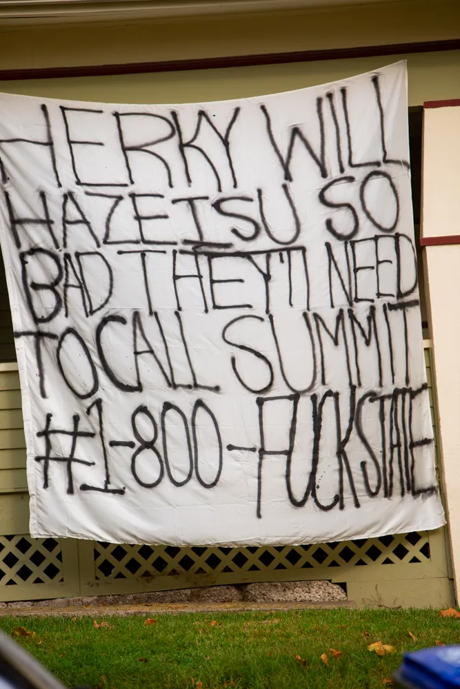 Homemade "Hate Week" banners line Iowa City streets, showcasing UI students' creativity and Hawkeye pride