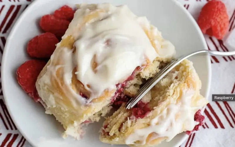 Homemade raspberry sweet rolls with light cream cheese glaze