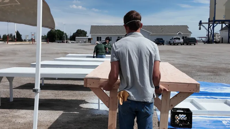 Volunteers build tables for 4-H exhibitors at Eastern Idaho State Fair