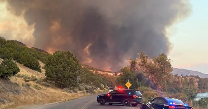 Wildfire explodes near Heise, driving families from their homes as firefighters battle to hold the line