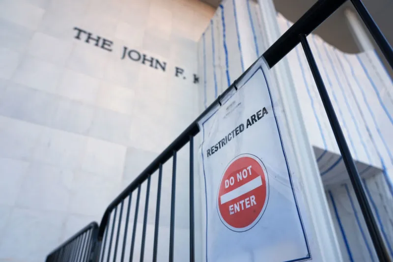 Trump pictured with poster that appears to say 'Kennedy Center demolished'