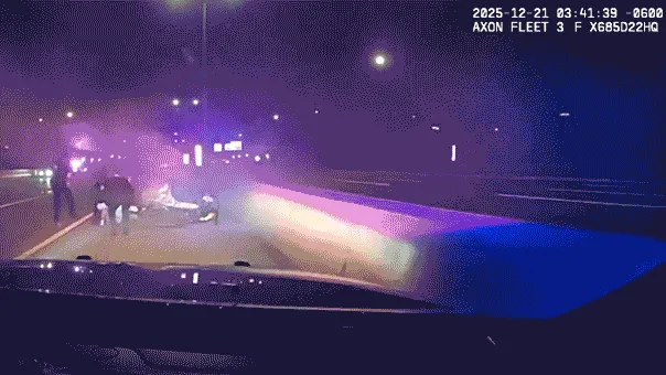 Illinois officers crawl under burning car to save trapped driver in dramatic Interstate 88 rescue