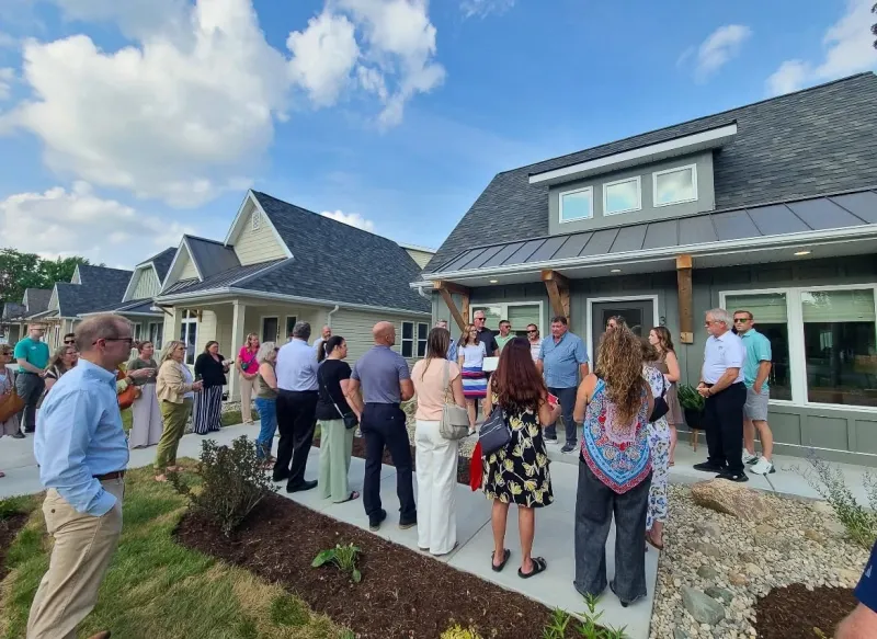 RIBBON CUT ON HOUSING ADDITION