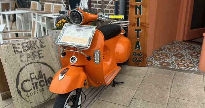 Parking ticket issued to restaurant's decorative scooter