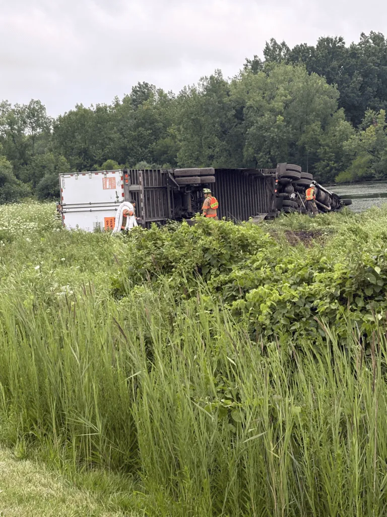 Tractor-trailer overturns, partially enters pond along I-80/90 in Porter County