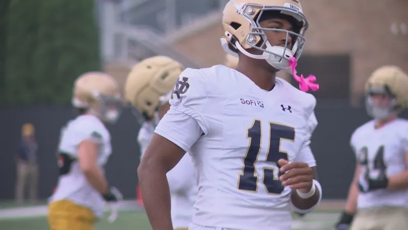 Co-defensive coordinator Aaron Henry pushing All-American Leonard Moore