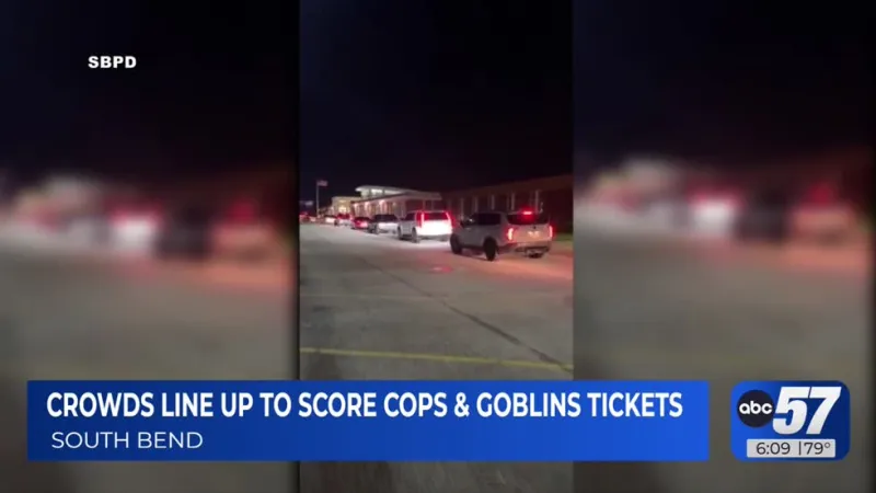 Cars line up hours before Cops and Goblins ticket window, line wrapping around police station