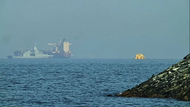 Iranian drones attack Bahrain and a ship is struck in the strait after U.S. airstrikes