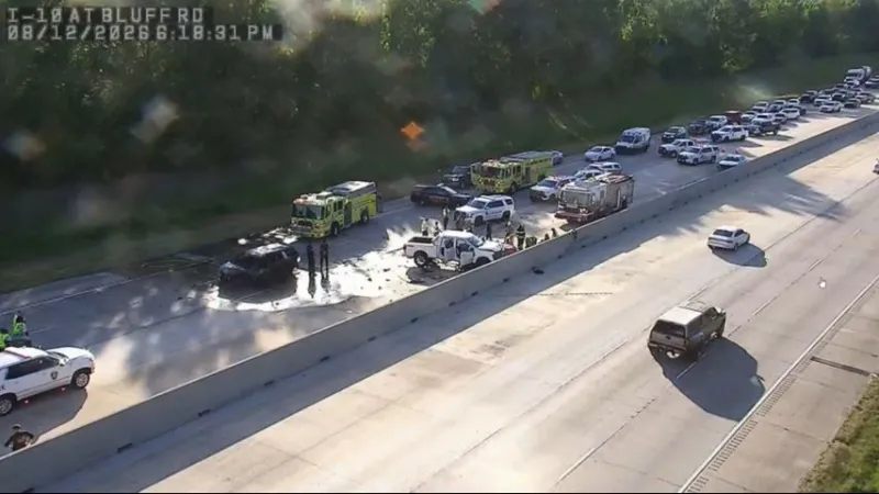 I-10 eastbound at Bluff Road blocked after four-vehicle crash leads to fire, entrapment
