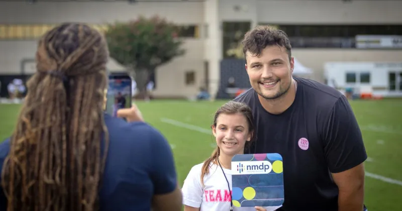 Saints, Dillon Radunz share their platform to help girl with rare disease find a donor.