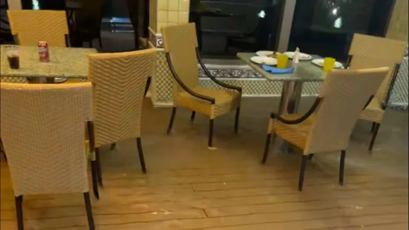 Water spills out of pool, onto deck of Carnival Valor as ship lists on Mississippi River