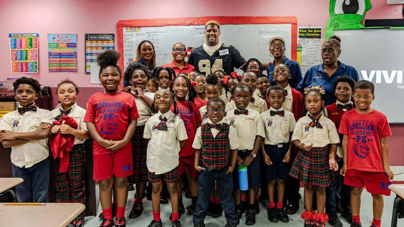 Photos: Cam Jordan visits Macmillan Academy