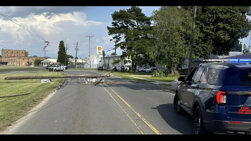 Downed telephone pole blocks roadway at East Bayou Road and Fourth Street in Donaldsonville