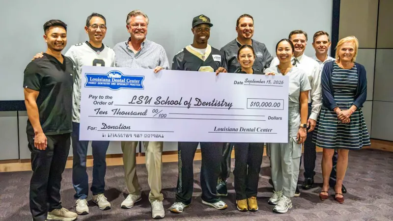 Photos: Travis Etienne Jr., Louisiana Dental Center present donation to LSU School of Dentistry