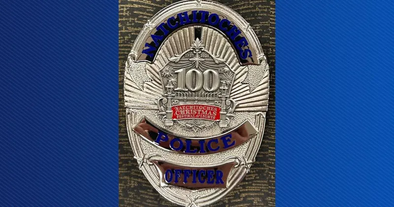 Natchitoches police officers wear commemorative badges for 100th Christmas Festival
