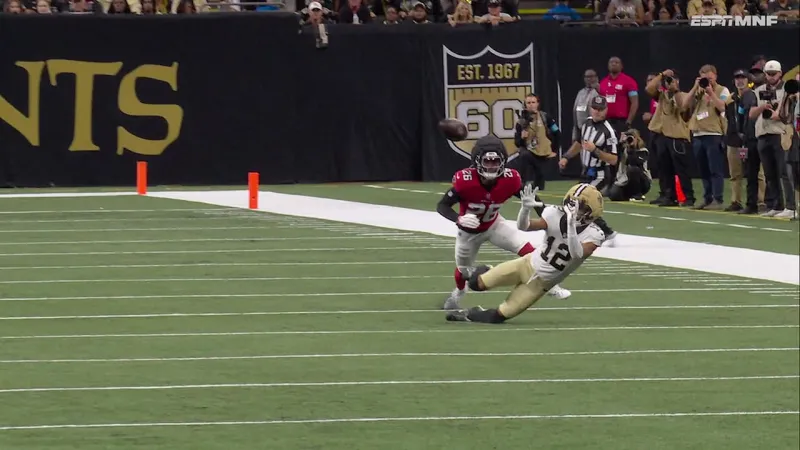 Chris Olave makes the catch on the ground from Tyler Shough