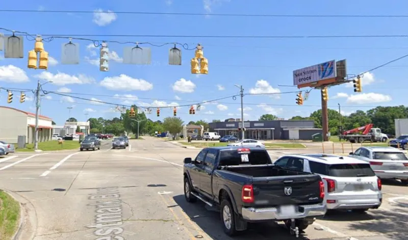 Man Exits Truck to Secure Potential Road Hazard in Lafayette