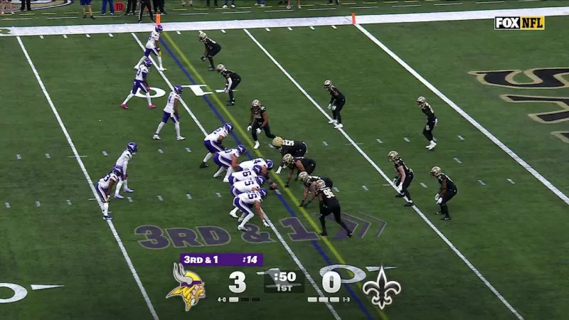Chase Young holds the football like a loaf of bread after retrieving Vikings' red-zone fumble