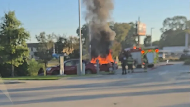 VIDEO: Car catches fire in McDonald's parking lot near Costco off Airline Highway