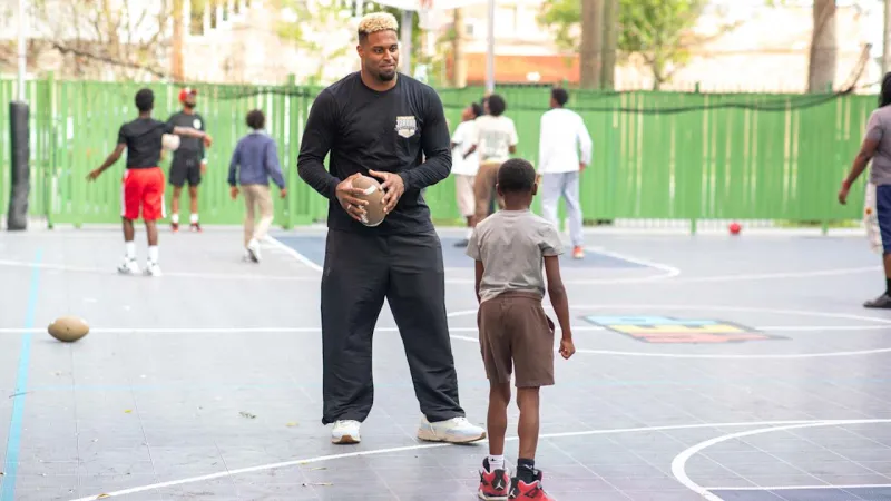 Photos: Cam Jordan visits Youth Empowerment Project