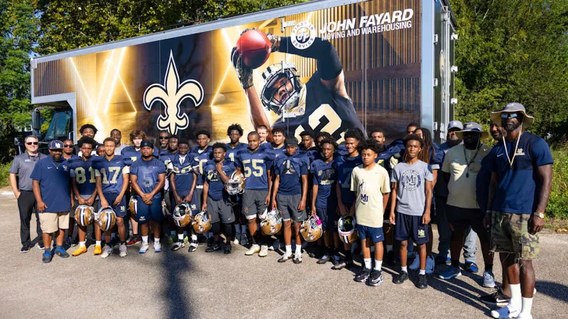 Photos: Jay'viar Suggs, John Fayard surprise Long Beach High School football team with new equipment