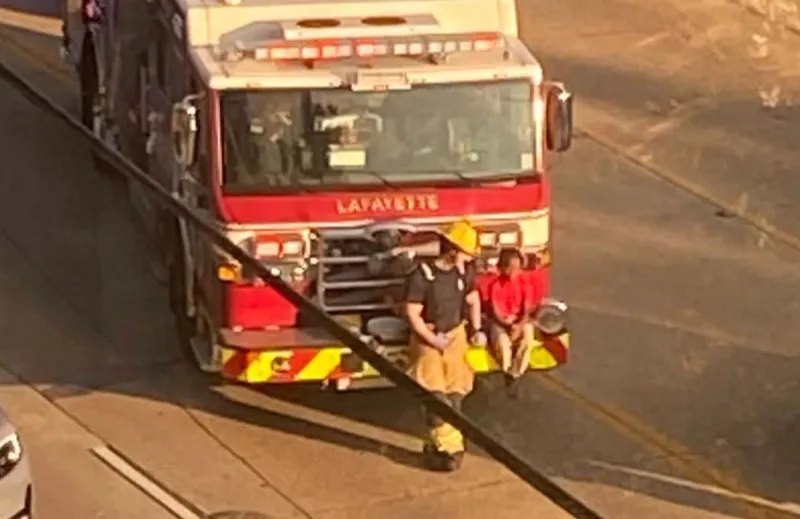 Lafayette Firefighter Seen Sitting With Kid After Vehicle Crash